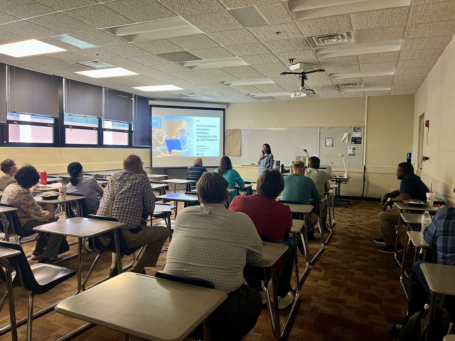 Faculty listening to a talk at the Student Success summit